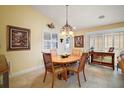 Bright dining room with a wood table and four chairs at 2428 Kingstree Pl, The Villages, FL 32162