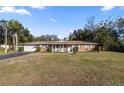 Brick ranch house with attached garage and large yard at 2937 Eagles Nest Rd, Fruitland Park, FL 34731