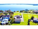 Aerial view of waterfront home with large yard and lake access at 3155 Lakeshore Dr, Mount Dora, FL 32757