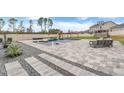 Luxury pool with fountains and spacious patio at 410 Cheeota Ct, Minneola, FL 34715