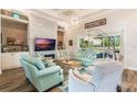 Spacious living room with fireplace and plenty of natural light at 5072 Greens Dr, Lady Lake, FL 32159