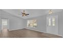 Bright living room with vinyl flooring and neutral walls at 979 Princeton Dr, Clermont, FL 34711