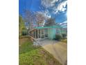 Mobile home with screened porch and grassy front yard at 1005 Oakland St. St, Tavares, FL 32778