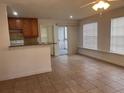 Kitchen features granite countertops and wood cabinets at 1075 S Hiawassee Rd # 911, Orlando, FL 32835