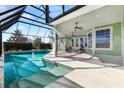 Inviting pool with screened-in patio and lounge chairs at 1107 Sugar Loaf Key Loop, Lady Lake, FL 32159