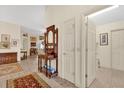 Bright entryway with hardwood floors and antique furniture at 1916 Antonia Pl, The Villages, FL 32159