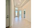 Clean entryway with tile floors and access to other rooms at 2022 Wallingford Loop, Mount Dora, FL 32757