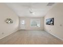 Bright living room featuring neutral wall colors and a ceiling fan at 2080 Nordic Ln, The Villages, FL 32163