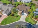 Aerial view of single Gathering home with landscaped yard and driveway at 2338 Mcclellanville Ter, The Villages, FL 32162