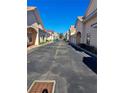 Neat row of light beige houses with terracotta roofs and lush greenery at 255 David Walker Dr # F5, Tavares, FL 32778