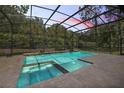 Inviting screened pool and spa with tranquil water features at 25833 Feather Ridge Ln, Sorrento, FL 32776