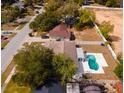 Bird's-eye view showcasing the house, pool, and surrounding neighborhood at 2715 N Dellwood Dr, Eustis, FL 32726