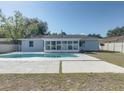 Inviting backyard oasis featuring a refreshing pool and ample patio space at 2715 N Dellwood Dr, Eustis, FL 32726