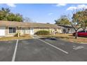 Exterior view showing condo building and parking lot at 30036 Tavares Ridge Blvd # 30036, Tavares, FL 32778