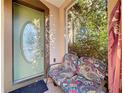 Inviting front porch with seating and a view of lush greenery at 5036 Gandross Ln, Mount Dora, FL 32757