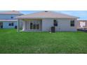 Spacious backyard with lush green grass and ample space for outdoor activities and relaxation at 5095 Firebush Dr, Apopka, FL 32712