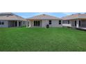 Expansive backyard with lush green grass, offering ample space for outdoor activities at 5131 Firebush Dr, Apopka, FL 32712