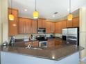 Spacious kitchen with stainless steel appliances and an island at 5929 Coquyt Dr, Mount Dora, FL 32757