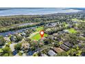 Property's location shown in an aerial view, near a lake at 6220 Topsail Rd, Lady Lake, FL 32159