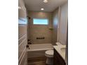 Clean bathroom featuring a tub, toilet, and modern vanity at 6851 Wendy Way, The Villages, FL 32163