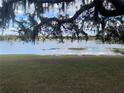 Peaceful lake view from the property, offering scenic beauty at 73 N Carol Ave, Mascotte, FL 34753