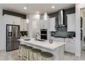 Modern kitchen with white cabinets, stainless steel appliances, and an island at 8675 Bridgeport Bay Cir, Mount Dora, FL 32757