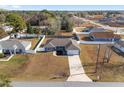 Aerial view of the house and surrounding properties at 105 Juniper Run, Ocala, FL 34480