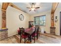 Cozy dining area with a wooden table and hardwood floors at 2187 County Road 243C, Wildwood, FL 34785