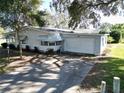 Single story home with a large yard and mature trees at 25143 Barrow Hl, Leesburg, FL 34748