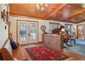 Inviting entryway with stained glass doors, brick accent wall, and ornate rug at 2685 Cr 564, Bushnell, FL 33513