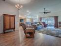 Spacious living room with hardwood floors and comfortable seating at 3281 Bell Ter, The Villages, FL 32163