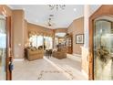 Bright living room showcasing neutral walls and flooring with a view to an adjacent dining space at 39335 Harbor Hills Blvd, Lady Lake, FL 32159