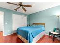 Light blue bedroom with wood floors, a full bed, and ceiling fan at 453 Hildalgo Dr, Lady Lake, FL 32159