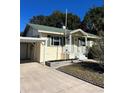 House exterior with carport and well maintained lawn at 505 W 10Th Ave, Mount Dora, FL 32757