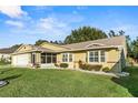 Single-story house with a screened porch and landscaped yard at 6525 Borg St, Leesburg, FL 34748