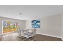 Bright dining room with sliding glass doors leading to the backyard at 7470 Lake Marsha Dr, Orlando, FL 32819