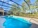 Relaxing screened-in pool area with a spa at 804 Orange Cosmos Blvd, Davenport, FL 33837