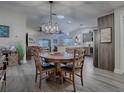 Open concept dining area with wood table and kitchen views at 830 Cortez Ave, The Villages, FL 32159