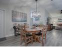 Bright dining room featuring a wood table and chairs, hardwood floors at 830 Cortez Ave, The Villages, FL 32159