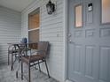 Cozy front porch with small table and chairs, perfect for relaxing at 830 Cortez Ave, The Villages, FL 32159