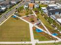 A well-maintained community park, featuring green spaces, play structures, and walkways, surrounded by charming homes at 10221 Medawar St, Orlando, FL 32827