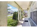 Welcoming covered front porch with decorative columns and manicured landscaping at 118 Shomate Dr, Longwood, FL 32750