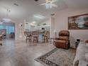 Kitchen features island with seating and stainless steel appliances at 1218 Augustine Dr, The Villages, FL 32159