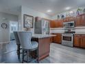 Modern kitchen with stainless steel appliances and granite countertops at 1235 Avenida De Las Casas, The Villages, FL 32159