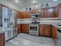 Modern kitchen with stainless steel appliances and granite countertops at 1235 Avenida De Las Casas, The Villages, FL 32159