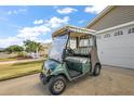 Golf cart parked in the driveway of the home at 1280 Mount Vernon Way, The Villages, FL 32162