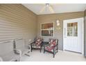 Relaxing screened porch with comfortable seating at 1280 Mount Vernon Way, The Villages, FL 32162