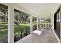 Front porch features a hammock and lush green landscape view at 1392 Sw 103Rd Ave, Webster, FL 33597