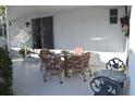 Covered patio with table and chairs, offering an outdoor dining space at 1401 W Highway 50 # 89, Clermont, FL 34711