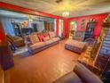 Spacious living room featuring hardwood floors and a fireplace at 1503 Woodlyn Dr, Leesburg, FL 34748